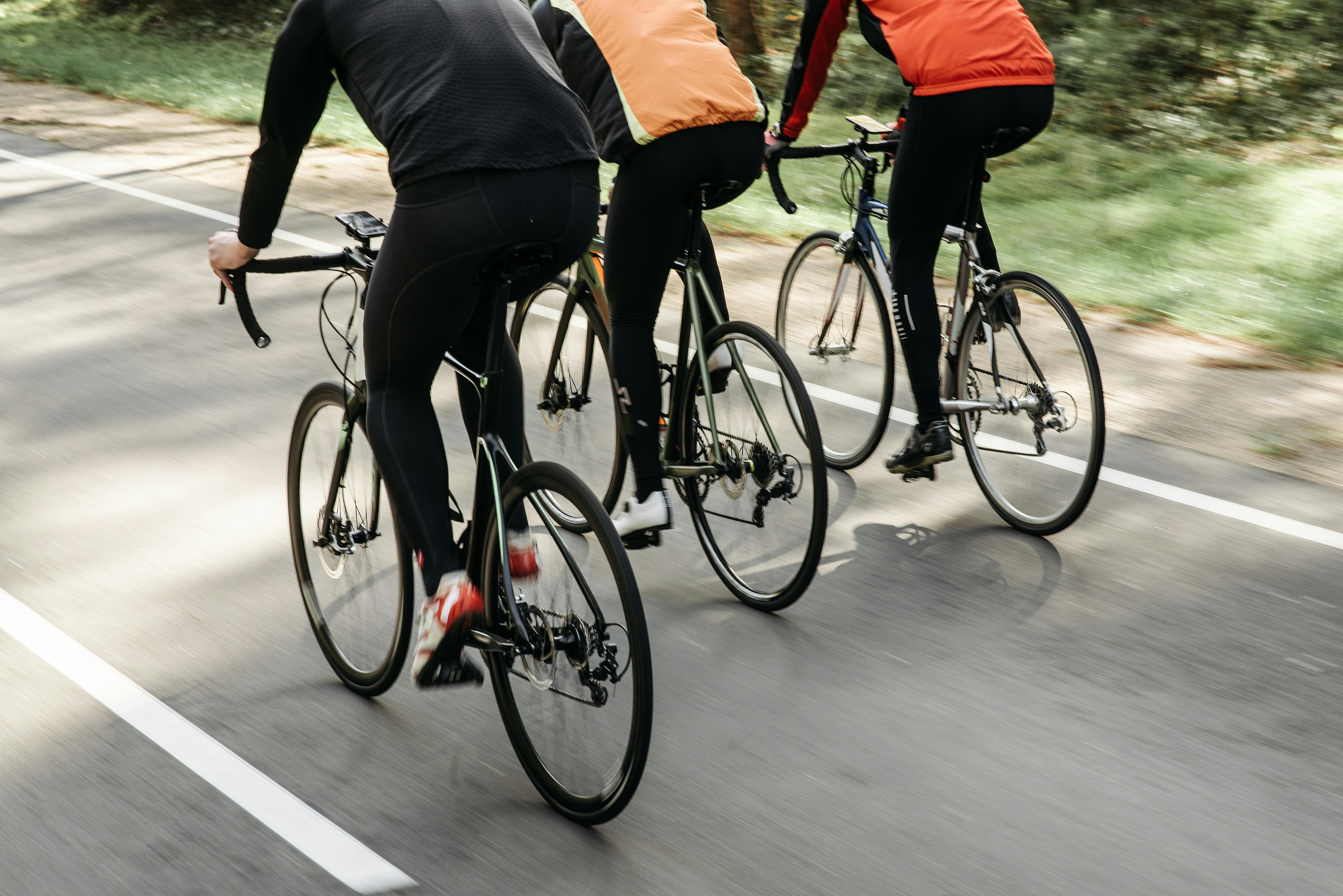 Woman cyclist in artistic motion blur